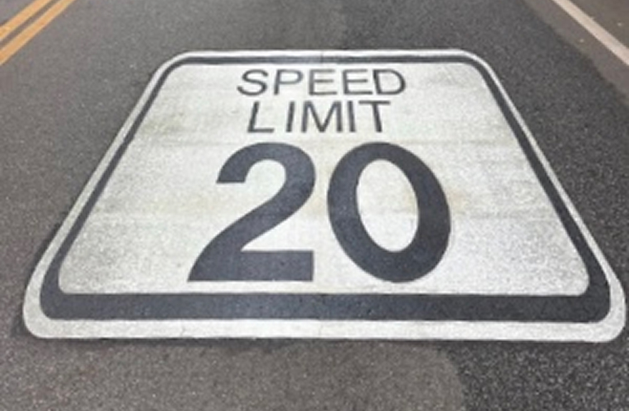 Speed Limit 20 sign painted on the road